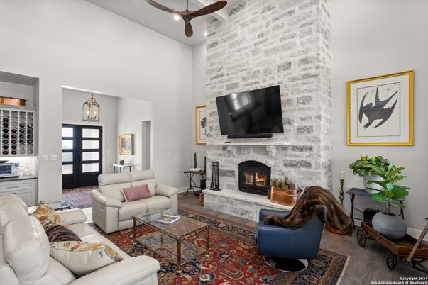 Fireplace, Interior, Living room, Pendant Lights, Recessed Lighting, Stone Walls, Wood Texture Flooring