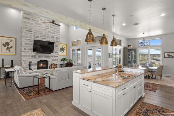 Dining room, Fireplace, Interior, Kitchen, Living room, Pendant Lights, Recessed Lighting, Stone Walls, Wood Texture Flooring