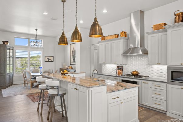 Dining room, Interior, Kitchen, Pendant Lights, Recessed Lighting, Stainless Steel Appliances, Wood Texture Flooring