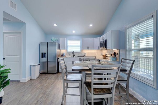 Dining room, Interior, Kitchen, Recessed Lighting, Stainless Steel Appliances, Wood Texture Flooring