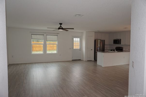 Empty room, Interior, Kitchen, Stainless Steel Appliances, Wood Texture Flooring