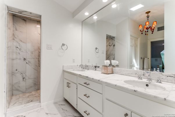 Bathroom, Chandelier, Dual Sink Vanities, Interior, Marble, Marble Walls, Recessed Lighting
