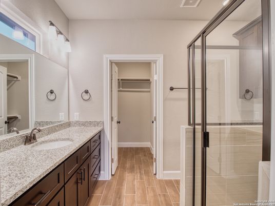 Bathroom, Dual Sink Vanities, Glass Shower, Interior, Walk-in Closets, Wood Texture Flooring