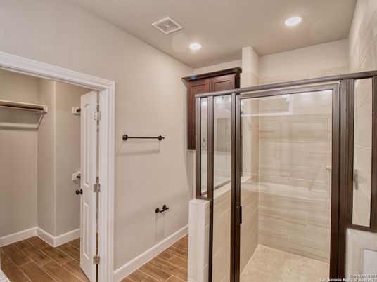 Bathroom, Glass Shower, Interior, Recessed Lighting, Walk-in Closets, Wood Texture Flooring