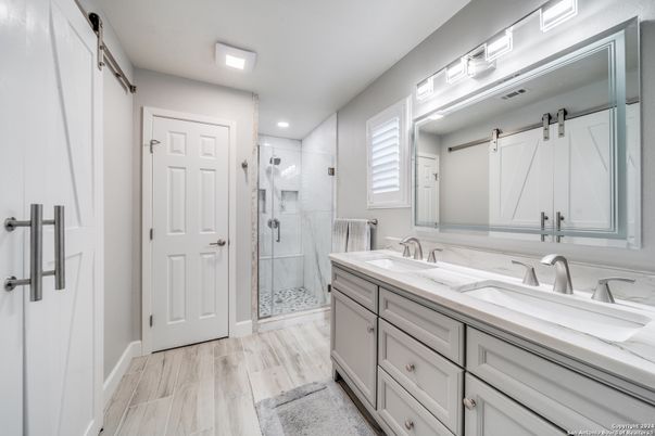 Bathroom, Dual Sink Vanities, Glass Shower, Interior, Recessed Lighting, Wood Texture Flooring