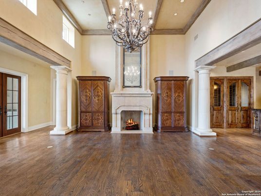 Chandelier, Fireplace, Interior, Recessed Lighting, Wooden Beams, Wood Texture Flooring