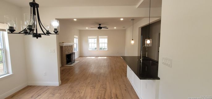 Fireplace, Interior, Pendant Lights, Recessed Lighting, Wood Texture Flooring