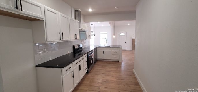Interior, Kitchen, Pendant Lights, Recessed Lighting, Stainless Steel Appliances, Wood Texture Flooring