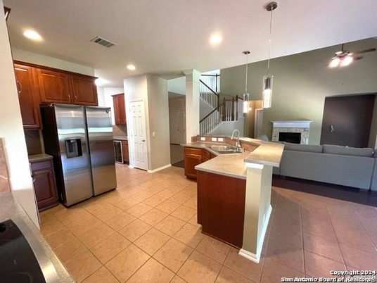 Fireplace, Interior, Kitchen, Living room, Pendant Lights, Recessed Lighting, Stainless Steel Appliances