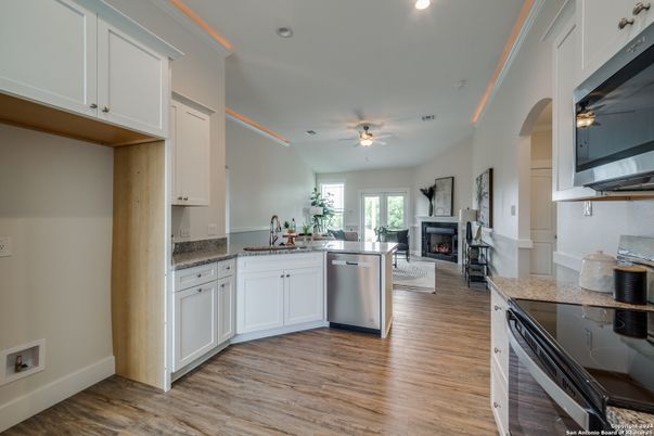 Fireplace, Interior, Kitchen, Recessed Lighting, Wood Texture Flooring
