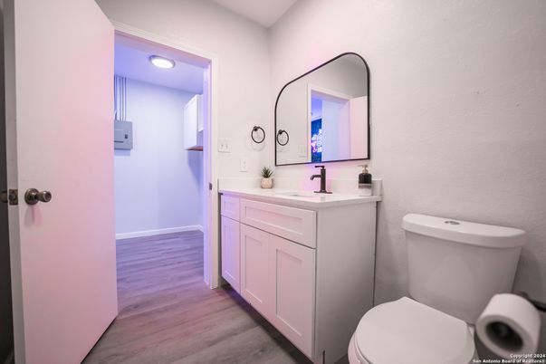 Bathroom, Dual Sink Vanities, Interior, Recessed Lighting, Wood Texture Flooring