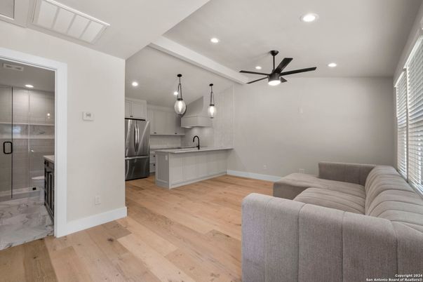 Interior, Kitchen, Living room, Marble, Pendant Lights, Recessed Lighting, Stainless Steel Appliances, Wood Texture Flooring