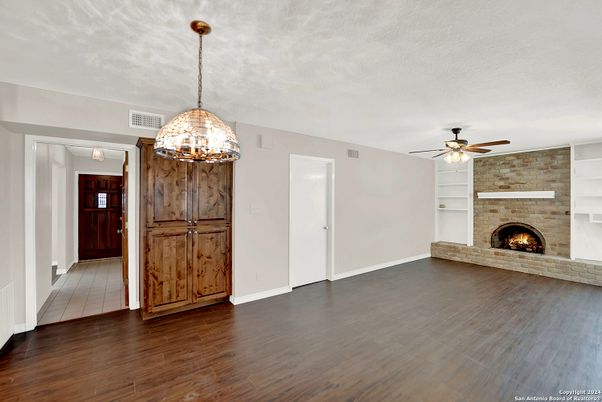 Empty room, Fireplace, Interior, Pendant Lights, Stone Walls, Wood Texture Flooring