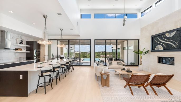 Fireplace, Interior, Kitchen, Living room, Pendant Lights, Recessed Lighting, Stainless Steel Appliances, Wood Texture Flooring