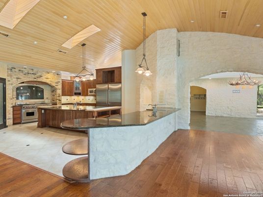 Interior, Kitchen, Pendant Lights, Recessed Lighting, Stainless Steel Appliances, Stone Walls, Wooden Ceilings, Wood Texture Flooring