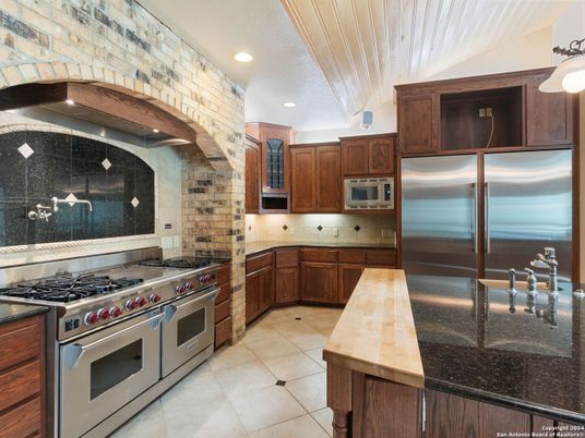 Interior, Kitchen, Recessed Lighting, Stainless Steel Appliances, Stone Walls