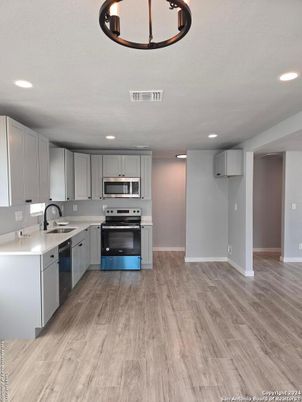 Interior, Kitchen, Recessed Lighting, Stainless Steel Appliances, Wood Texture Flooring