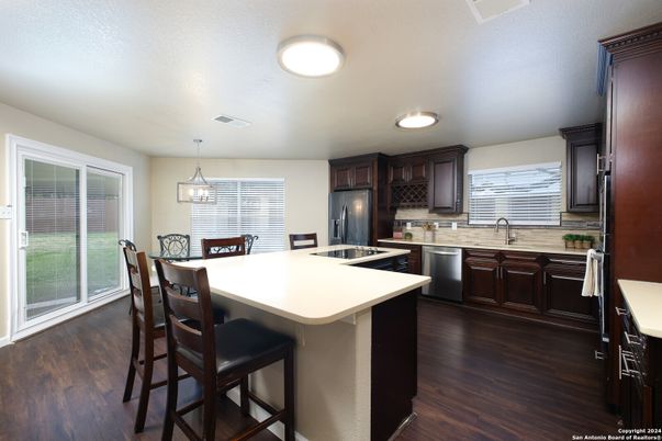 Dining room, Interior, Kitchen, Pendant Lights, Stainless Steel Appliances, Wood Texture Flooring