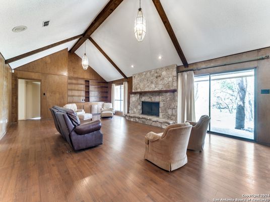 Fireplace, Interior, Living room, Pendant Lights, Recessed Lighting, Stone Walls, Wooden Beams, Wood Texture Flooring, Wooden Walls