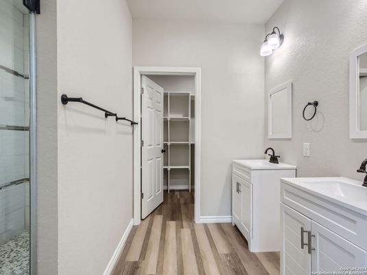 Bathroom, Dual Sink Vanities, Glass Shower, Interior, Walk-in Closets, Wood Texture Flooring