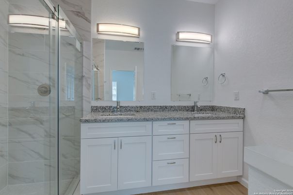 Bathroom, Dual Sink Vanities, Glass Shower, Interior, Marble Walls, Wood Texture Flooring