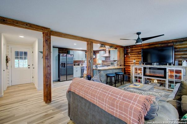 Fireplace, Interior, Kitchen, Living room, Recessed Lighting, Wood Texture Flooring, Wooden Walls