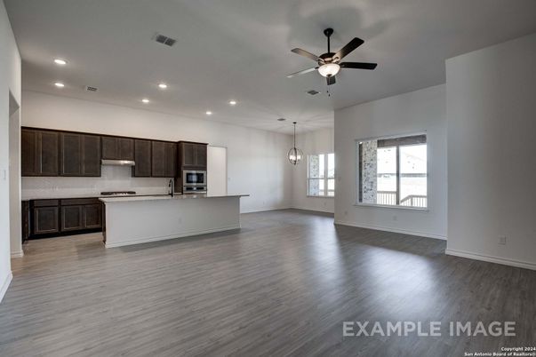 Empty room, Interior, Kitchen, Pendant Lights, Recessed Lighting, Stainless Steel Appliances, Wood Texture Flooring