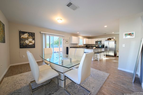 Dining room, Interior, Kitchen, Recessed Lighting, Stainless Steel Appliances, Wood Texture Flooring