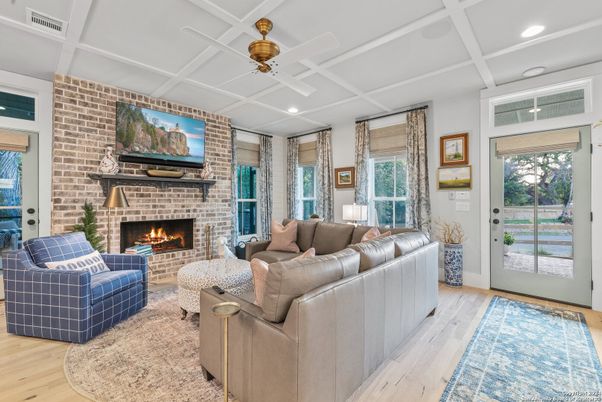 Fireplace, Interior, Living room, Recessed Lighting, Stone Walls, Wood Texture Flooring