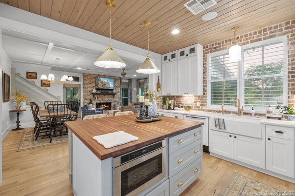 Dining room, Fireplace, Interior, Kitchen, Pendant Lights, Recessed Lighting, Stone Walls, Wooden Ceilings, Wood Texture Flooring