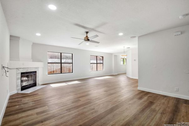 Empty room, Fireplace, Interior, Pendant Lights, Recessed Lighting, Wood Texture Flooring