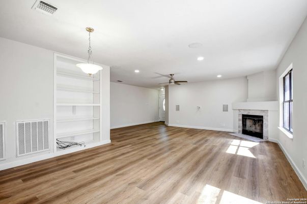 Empty room, Fireplace, Interior, Pendant Lights, Recessed Lighting, Wood Texture Flooring