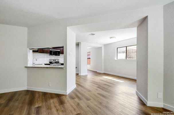 Empty room, Interior, Kitchen, Stainless Steel Appliances, Wood Texture Flooring