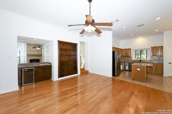 Fireplace, Interior, Kitchen, Recessed Lighting, Stainless Steel Appliances, Wood Texture Flooring