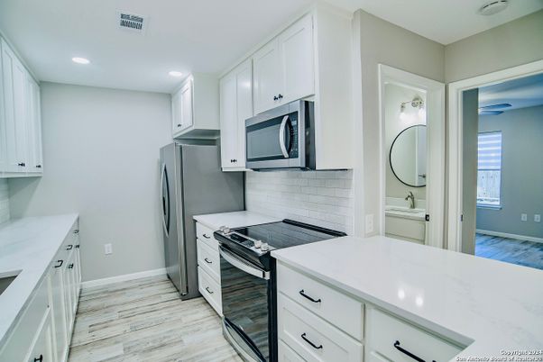 Interior, Kitchen, Recessed Lighting, Stainless Steel Appliances, Wood Texture Flooring