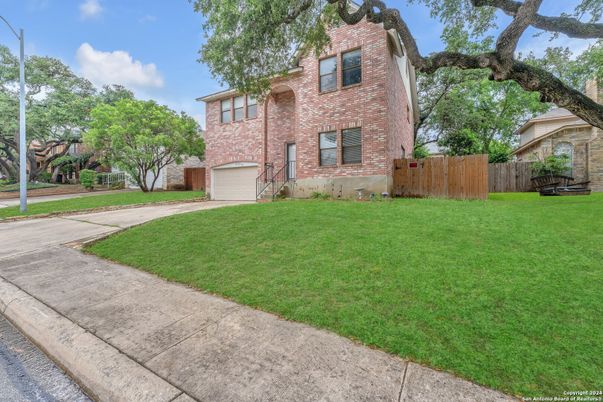 Attached, Backyard, Exterior, Facade, Brick Facade, Tudor Revival