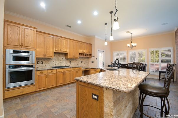 Chandelier, Dining room, Interior, Kitchen, Pendant Lights, Recessed Lighting, Stainless Steel Appliances