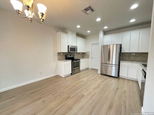 Chandelier, Interior, Kitchen, Recessed Lighting, Stainless Steel Appliances, Wood Texture Flooring