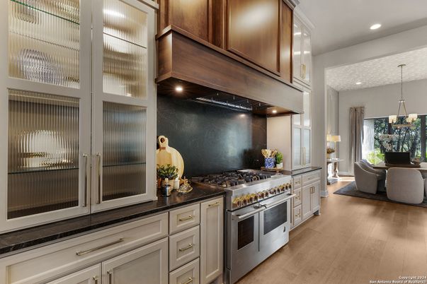 Chandelier, Dining room, Interior, Kitchen, Pendant Lights, Recessed Lighting, Stainless Steel Appliances, Wood Texture Flooring