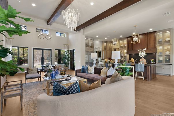 Chandelier, Dining room, Interior, Kitchen, Living room, Pendant Lights, Recessed Lighting, Stainless Steel Appliances, Wooden Beams, Wood Texture Flooring