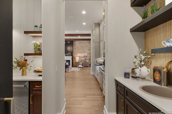 Fireplace, Interior, Kitchen, Recessed Lighting, Stainless Steel Appliances, Stone Walls, Wood Texture Flooring