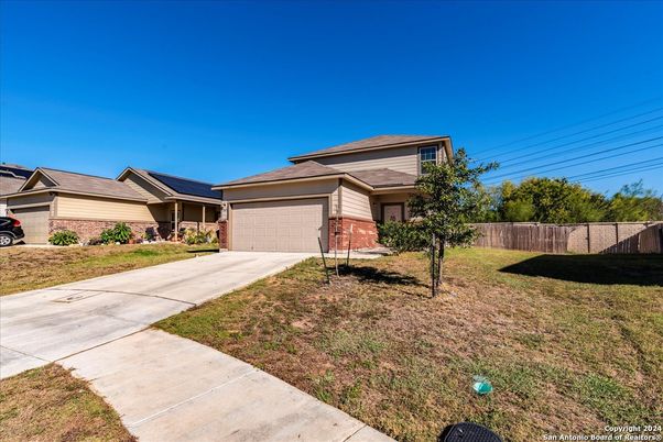 Attached, Backyard, Exterior, Facade, Brick Facade, None