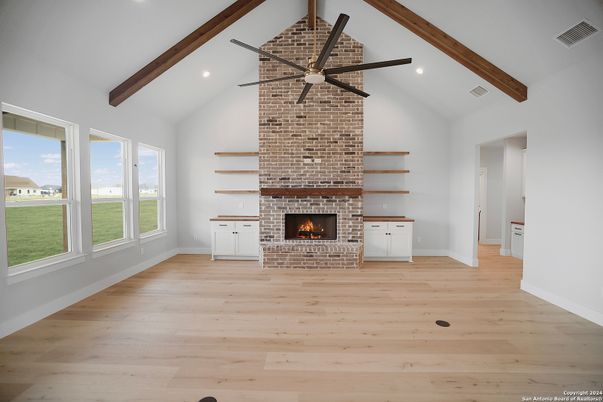 Empty room, Fireplace, Interior, Recessed Lighting, Stone Walls, Wooden Beams, Wood Texture Flooring