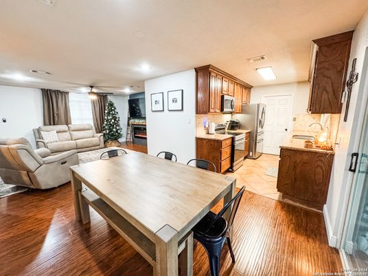 Dining room, Interior, Kitchen, Living room, Recessed Lighting, Stainless Steel Appliances, Wood Texture Flooring
