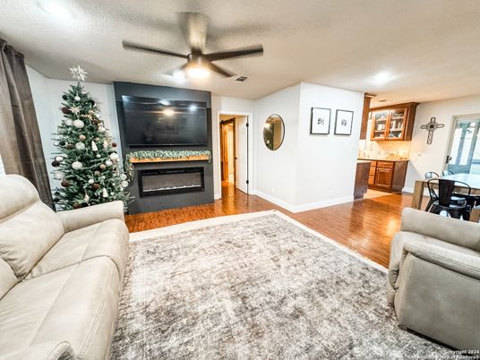 Dining room, Fireplace, Interior, Living room, Recessed Lighting, Wood Texture Flooring