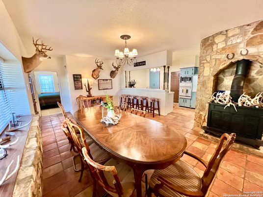 Chandelier, Dining room, Fireplace, Interior, Kitchen, Stone Walls