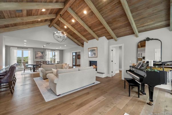 Chandelier, Dining room, Fireplace, Interior, Living room, Piano, Recessed Lighting, Wooden Beams, Wooden Ceilings, Wood Texture Flooring