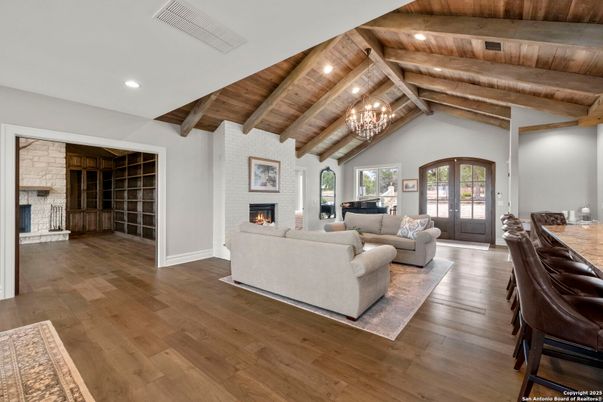 Chandelier, Fireplace, Interior, Living room, Recessed Lighting, Wooden Beams, Wooden Ceilings, Wood Texture Flooring