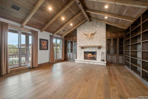 Empty room, Fireplace, Interior, Recessed Lighting, Stone Walls, Wooden Beams, Wooden Ceilings, Wood Texture Flooring