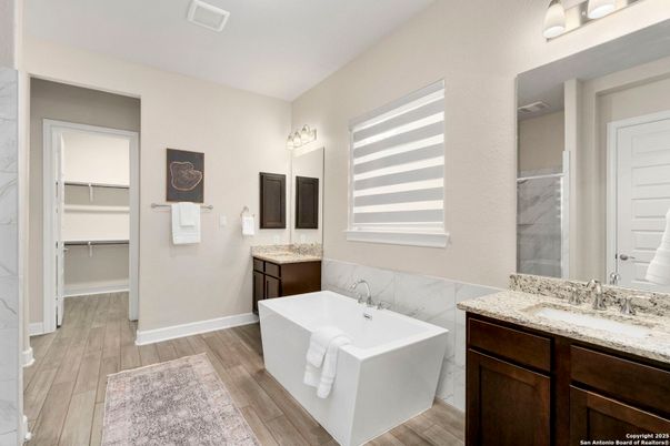 Bathroom, Dual Sink Vanities, Free Standing Baths, Interior, Marble Walls, Walk-in Closets, Wood Texture Flooring